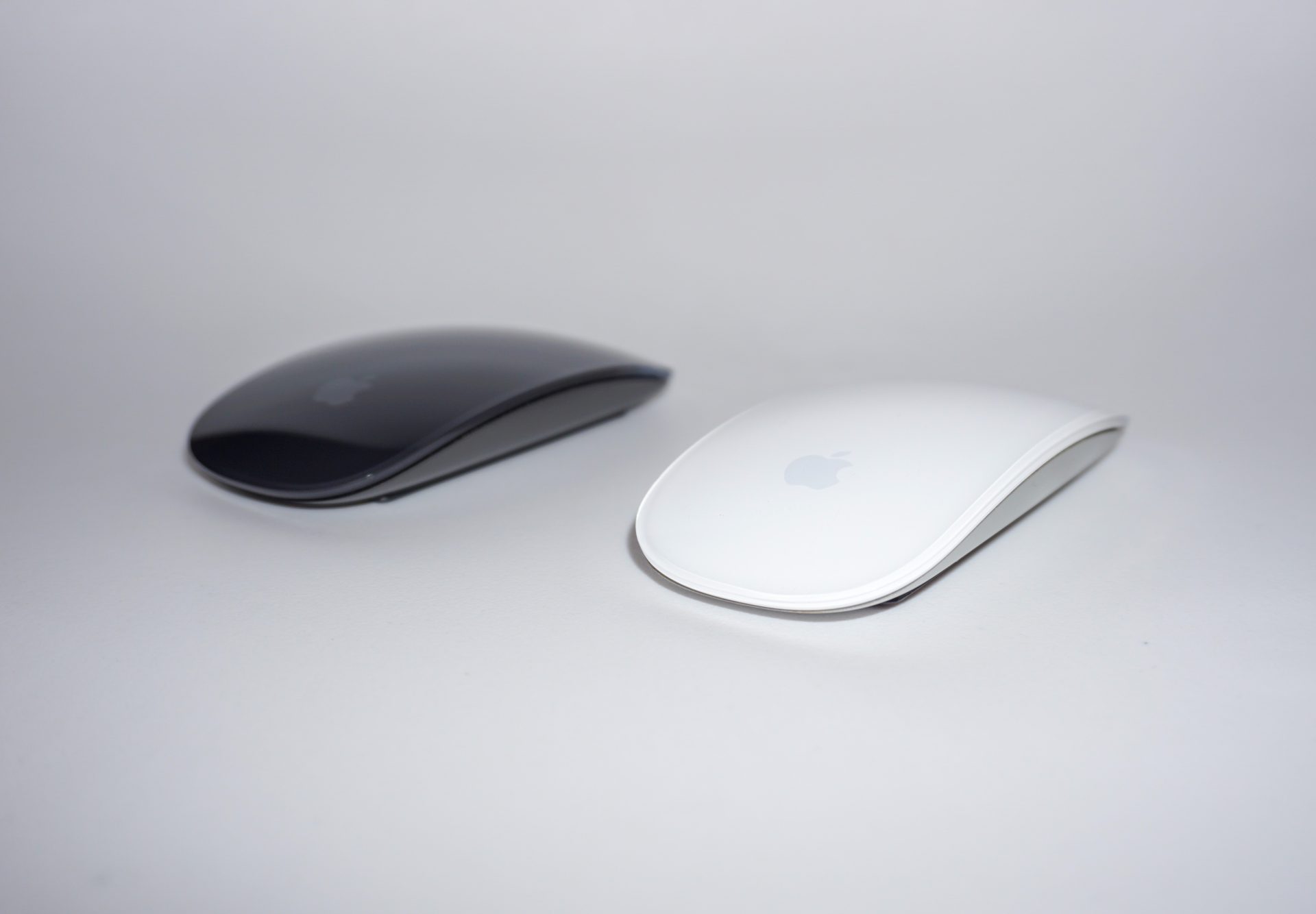 black apple mouse and white apple mouse