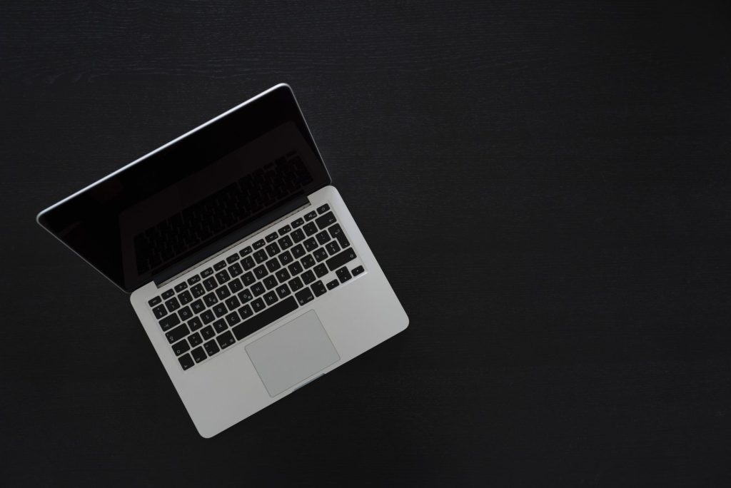 image of macbook with black screen and background